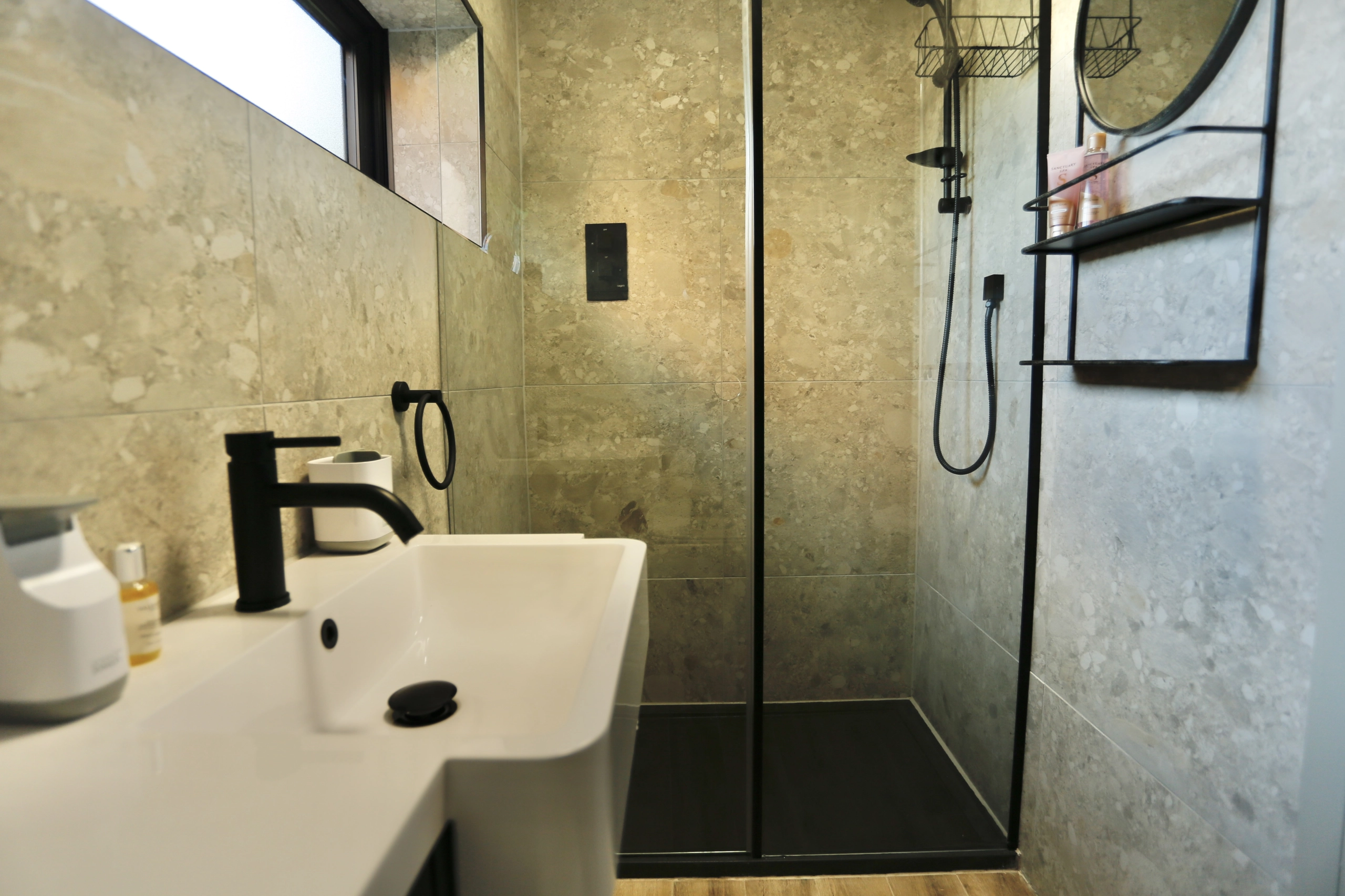a bathroom with a sink and a mirror at Havendale Accessible Holiday Cottage