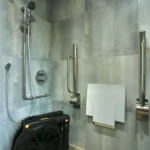 a bathroom with a toilet and a shower at Havendale Accessible Holiday Cottage