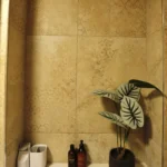 a bathroom with a plant in a vase at Havendale Accessible Holiday Cottage