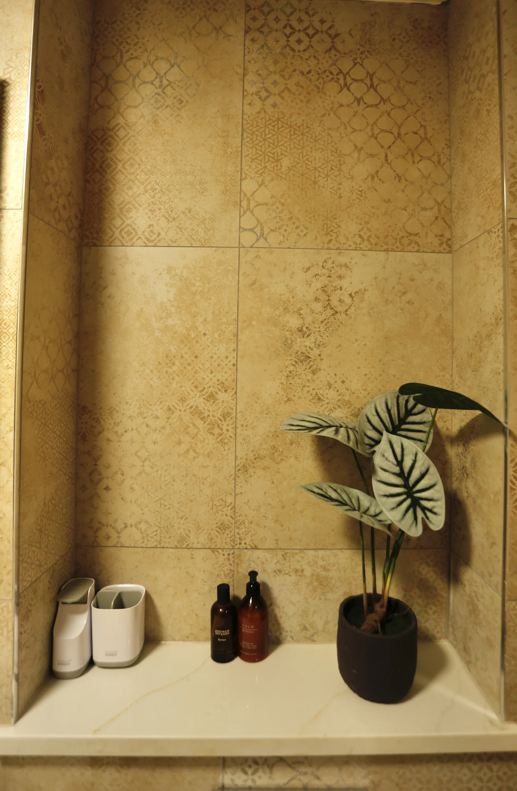 a bathroom with a plant in a vase at Havendale Accessible Holiday Cottage