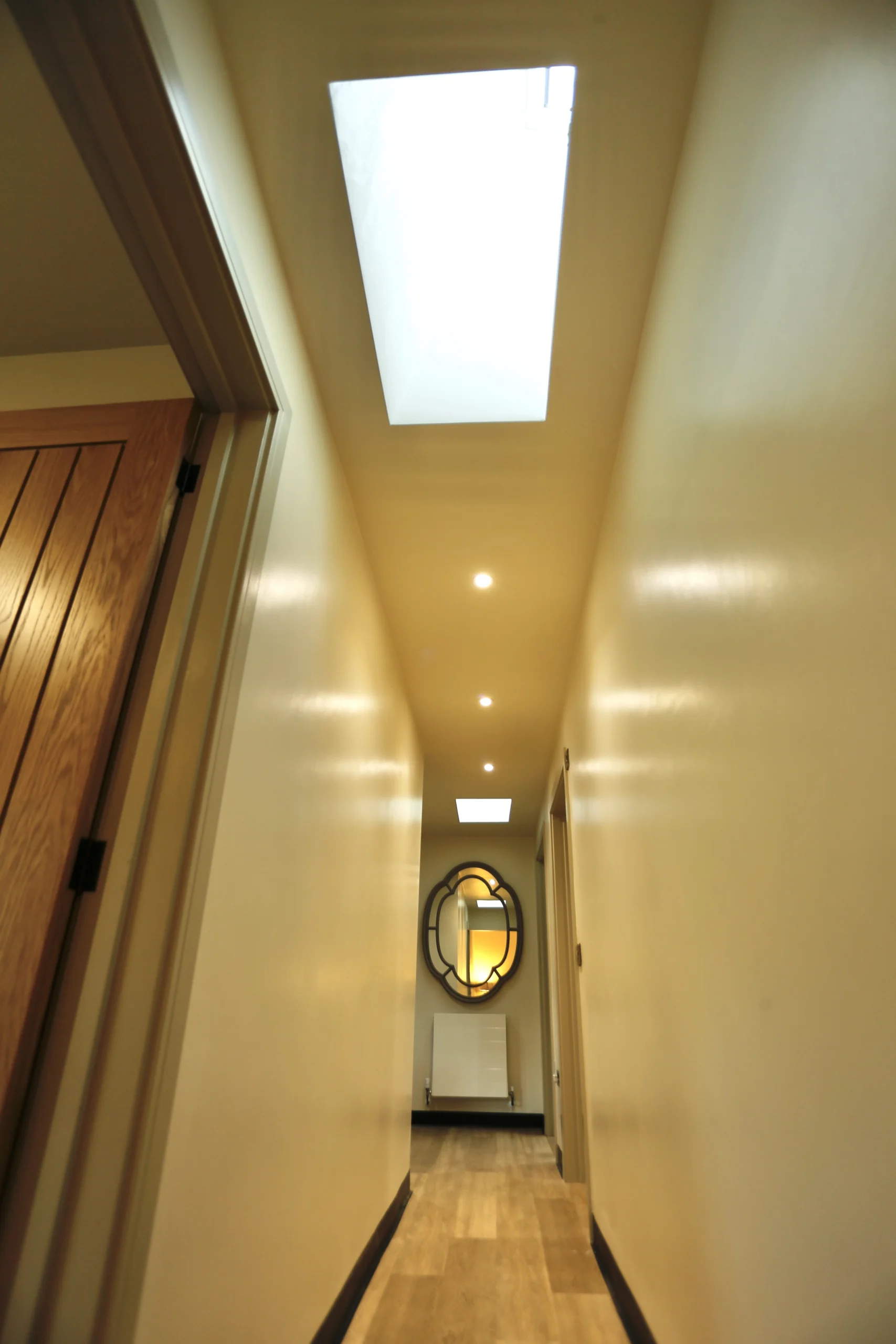 a long hallway with a skylight above at Havendale Accessible Holiday Cottage