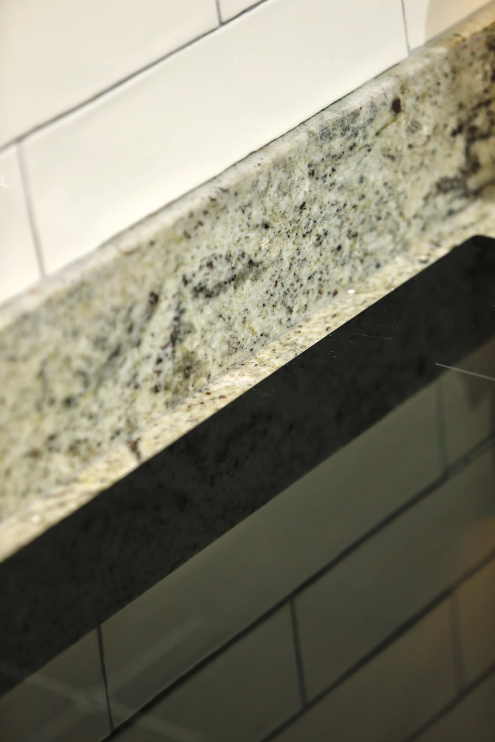 a close up of a counter top with a white tile at Havendale Accessible Holiday Cottage
