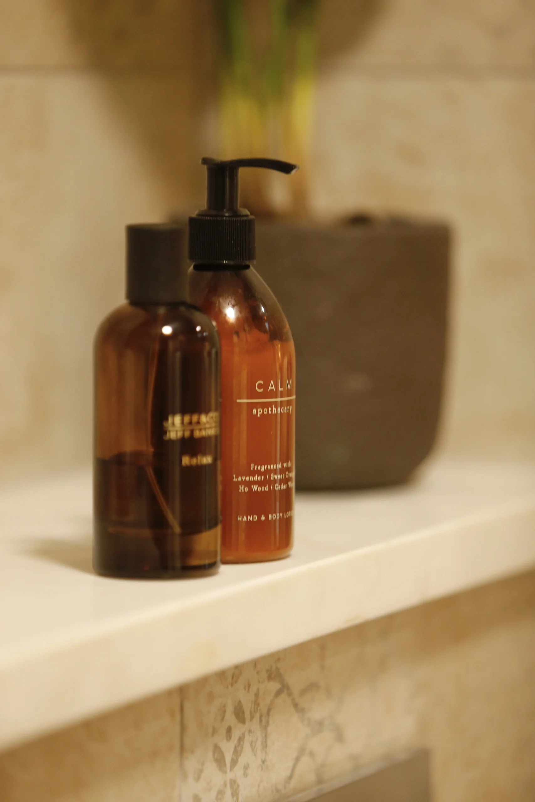 a bottle of liquid sitting on a shelf at Havendale Accessible Holiday Cottage