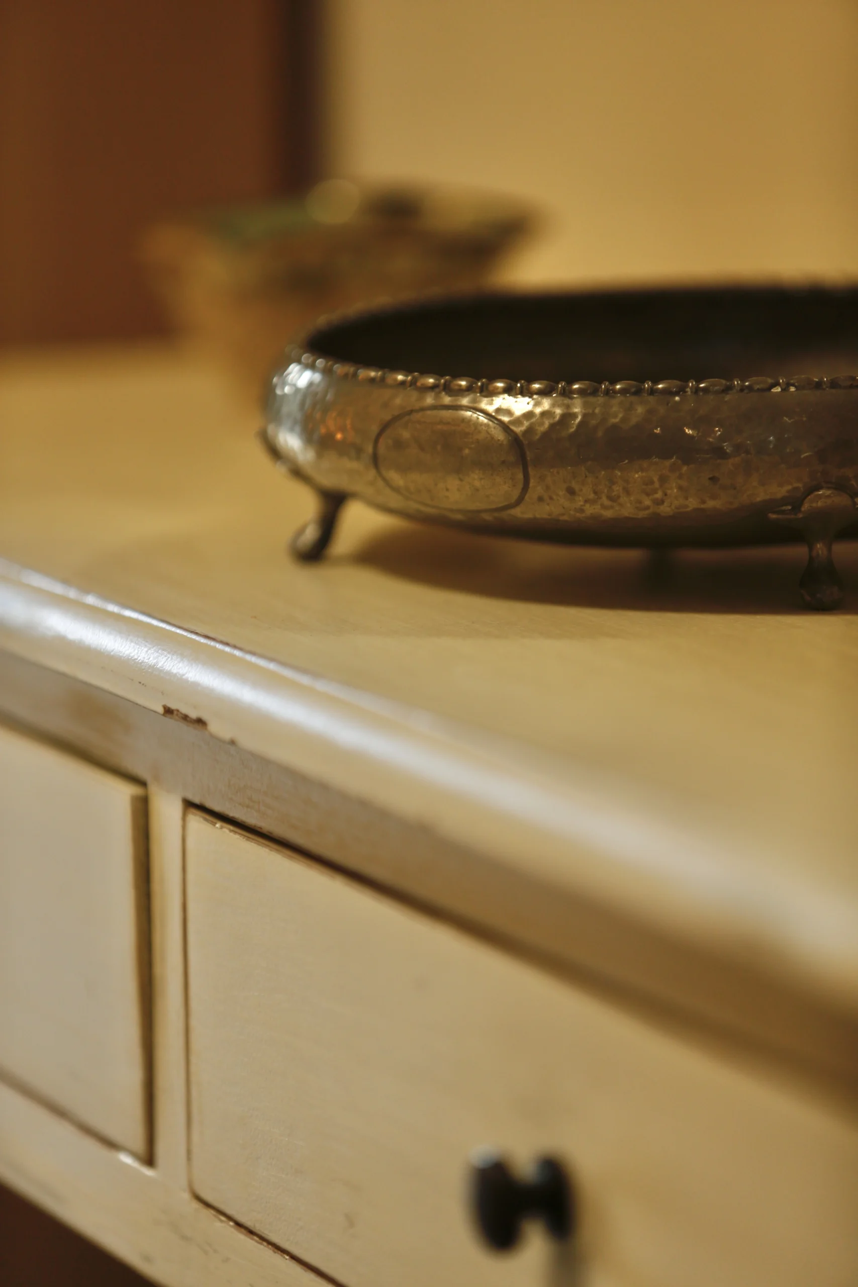 a silver bowl on a white dresser at Havendale Accessible Holiday Cottage