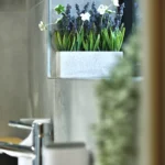 a bathroom with a sink and a mirror at Havendale Accessible Holiday Cottage