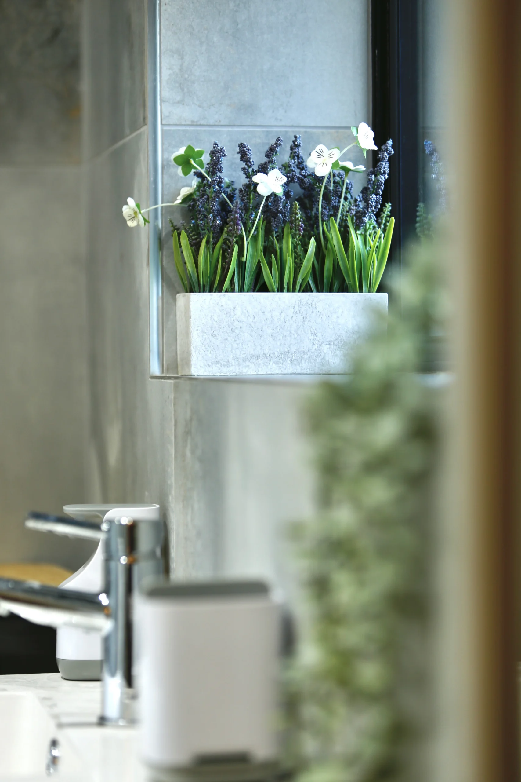 a bathroom with a sink and a mirror at Havendale Accessible Holiday Cottage