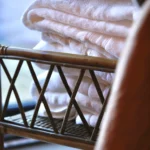 a stack of folded towels on a chair at Havendale Accessible Holiday Cottage