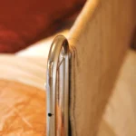 a bed with a white blanket at Havendale Accessible Holiday Cottage