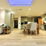 a living room with a couch and a table at Havendale Accessible Holiday Cottage