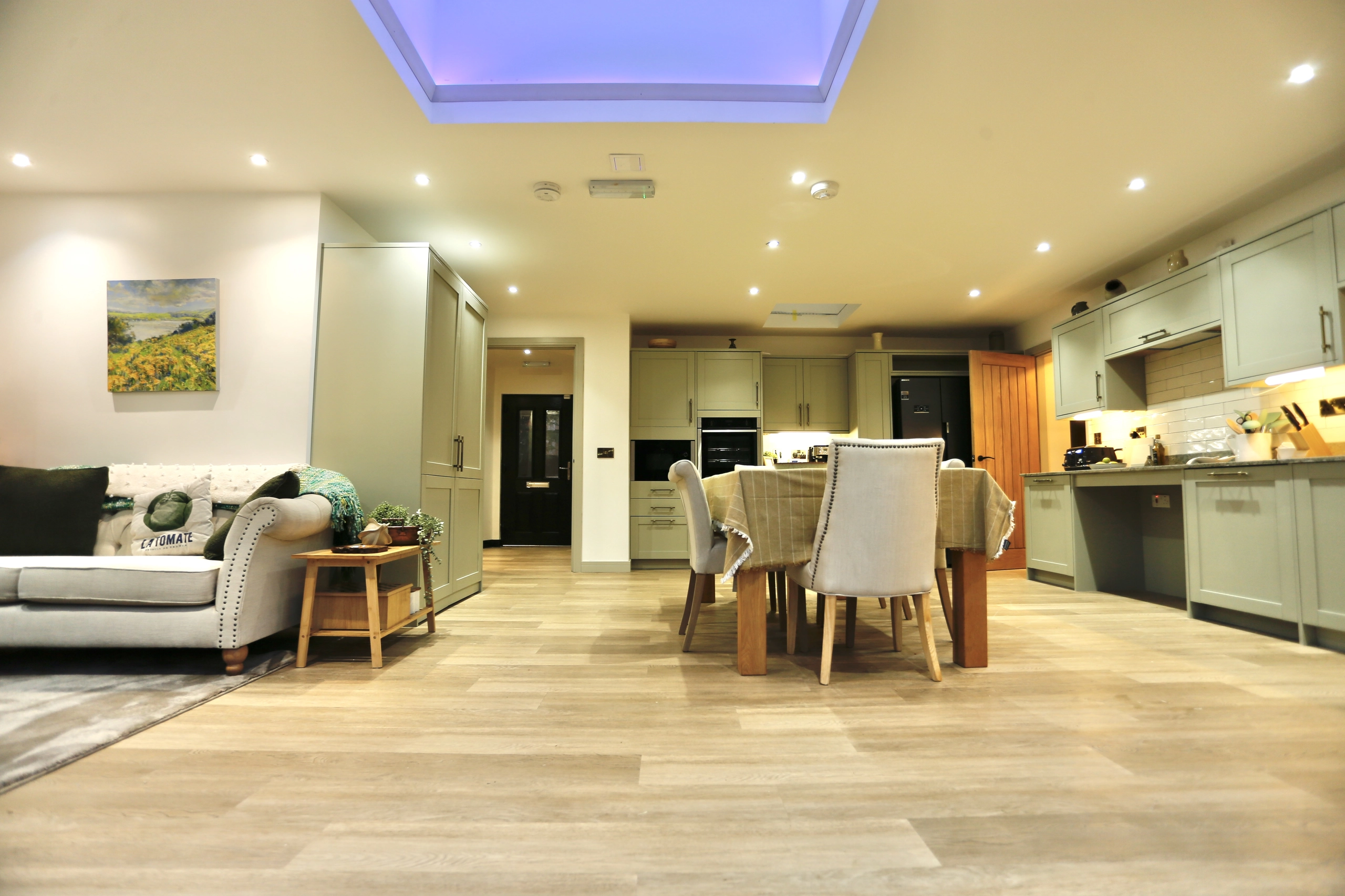 a living room with a couch and a table at Havendale Accessible Holiday Cottage