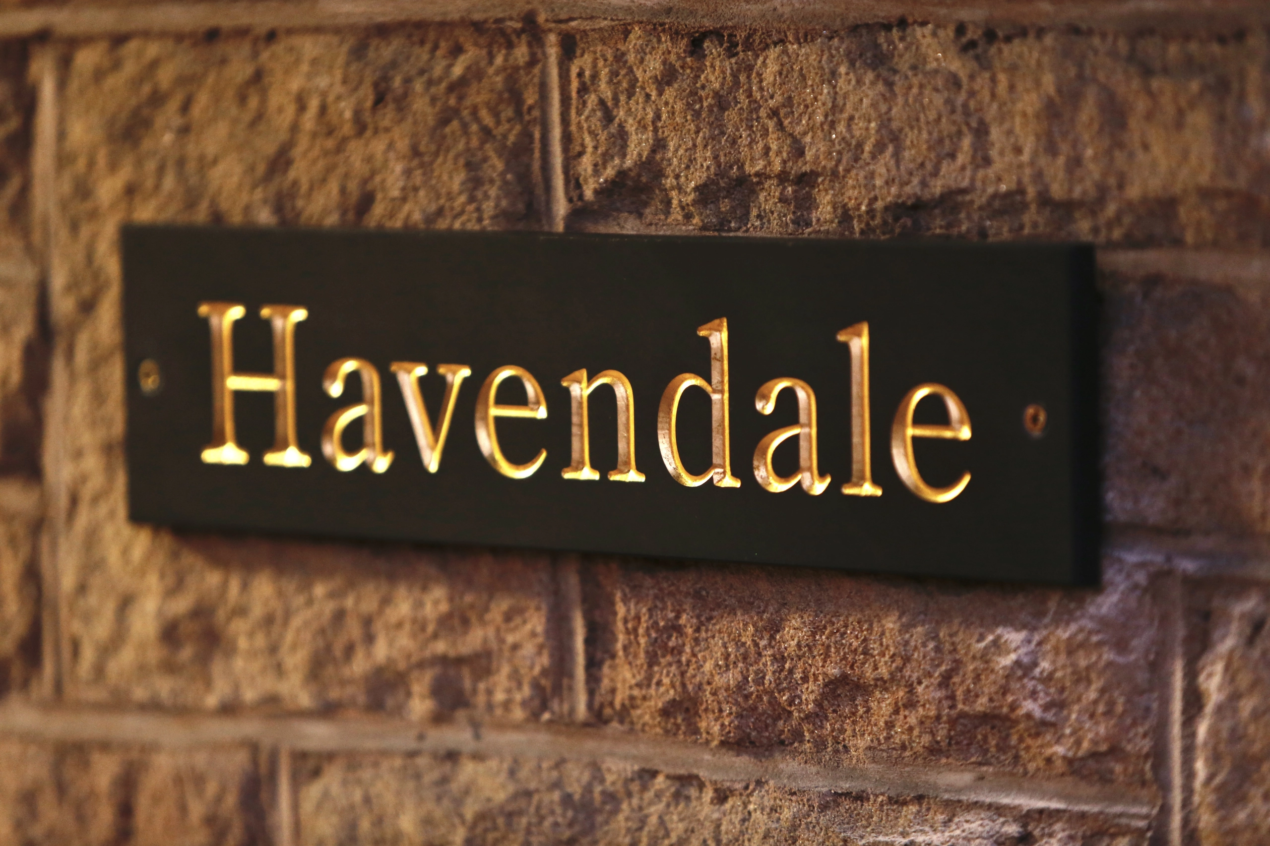 a sign on a brick wall that says havenia at Havendale Accessible Holiday Cottage