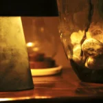 a vase with a flower inside of it at Havendale Accessible Holiday Cottage