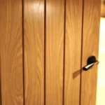 a door with a black handle at Havendale Accessible Holiday Cottage