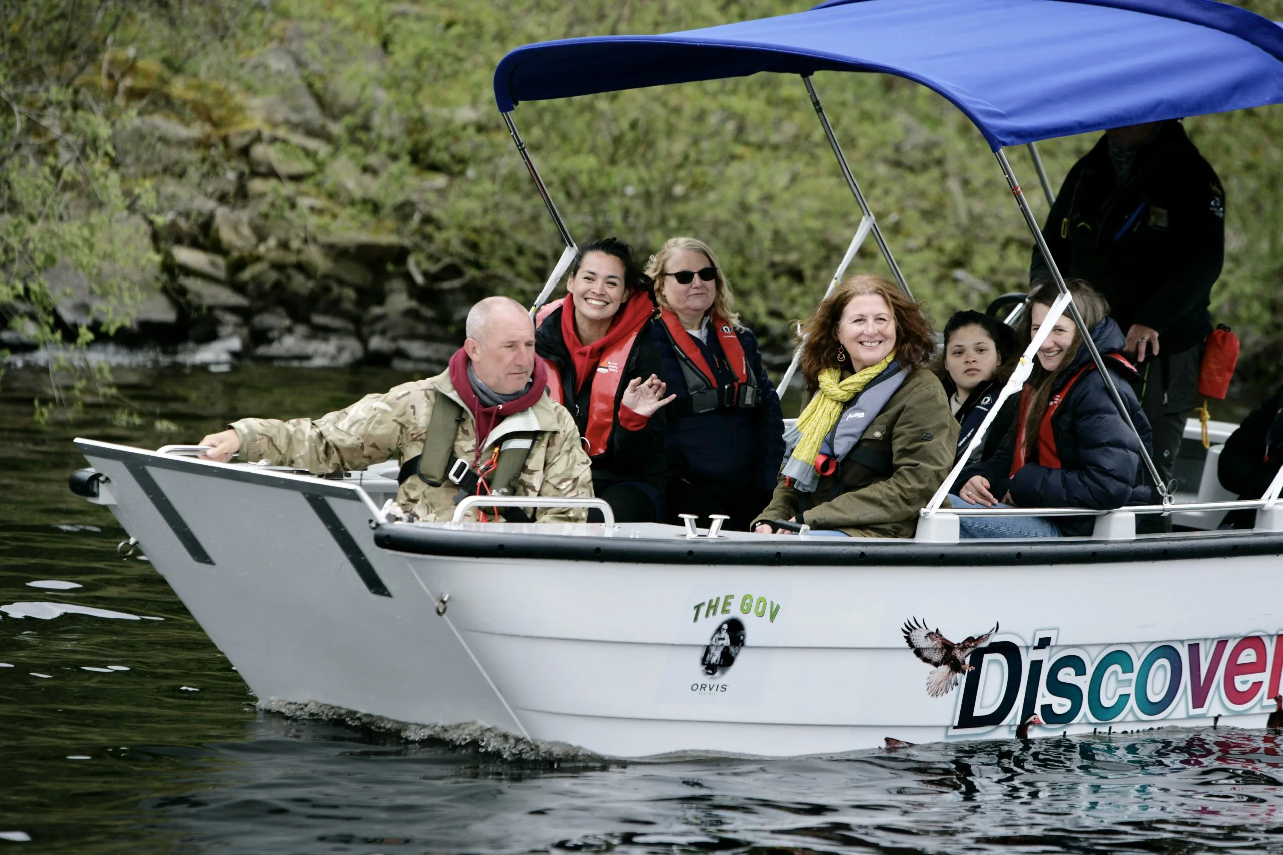 a group of people in a boat on a river on a trip from Havendale Accessible Holiday Cottage