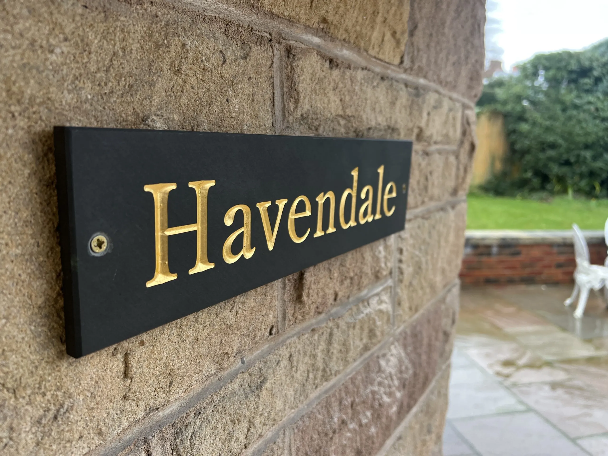 a black and gold plaque with the word Havendale on it at Havendale Accessible Holiday Cottage