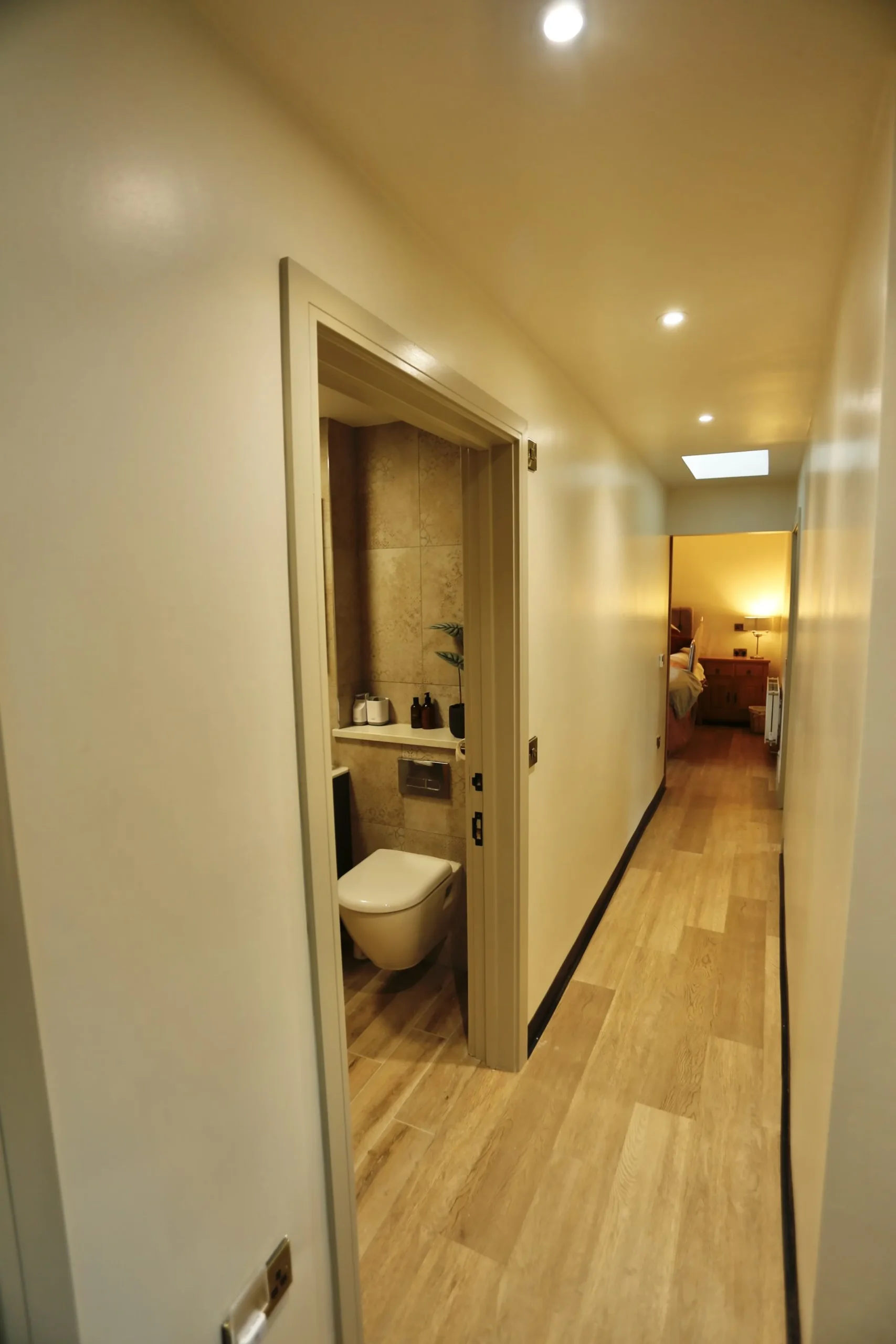 a bathroom with a toilet and internal view Havendale Accessible Holiday Cottage