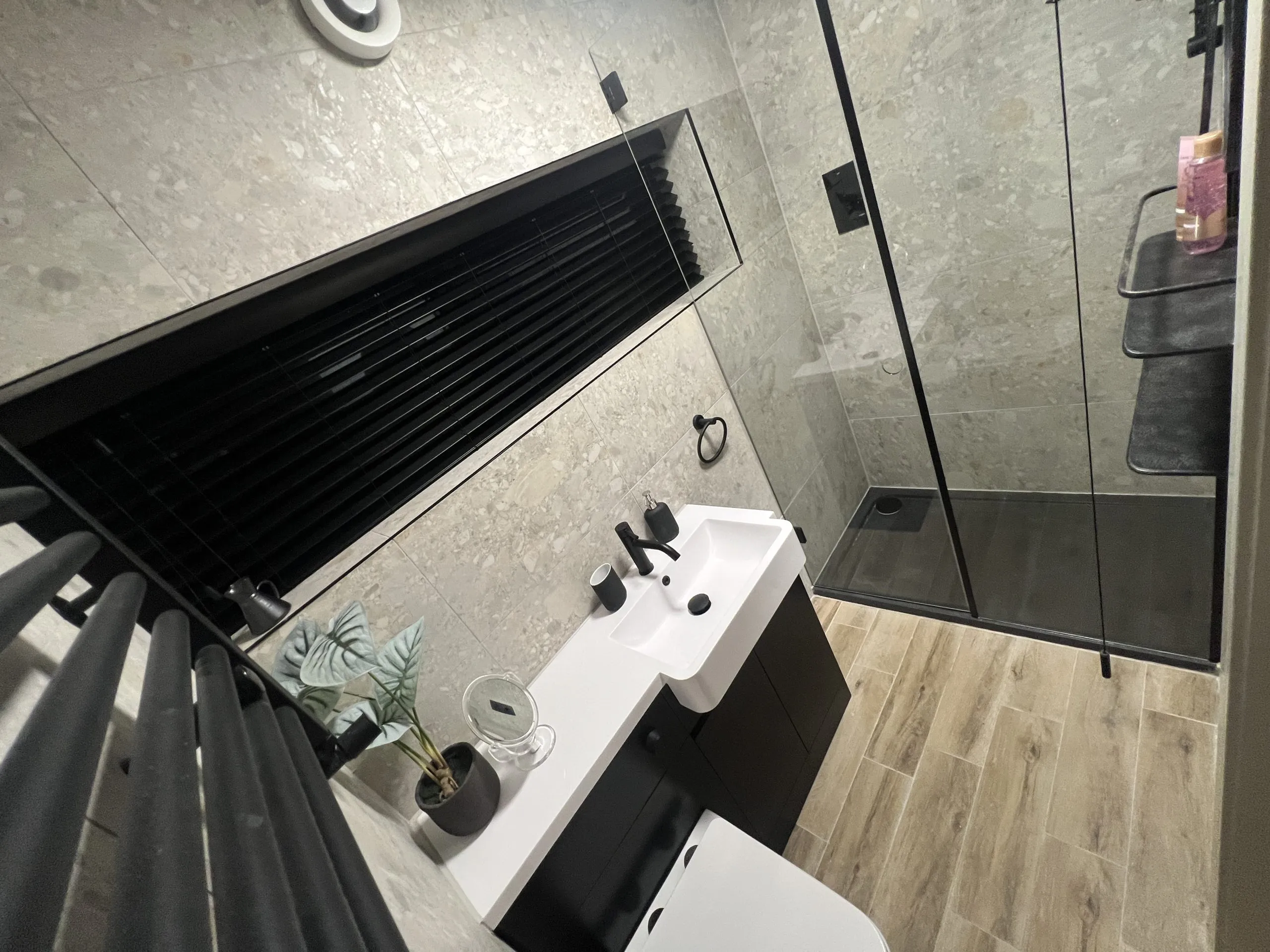 a bathroom with a sink and a shower at Havendale Accessible Holiday Cottage