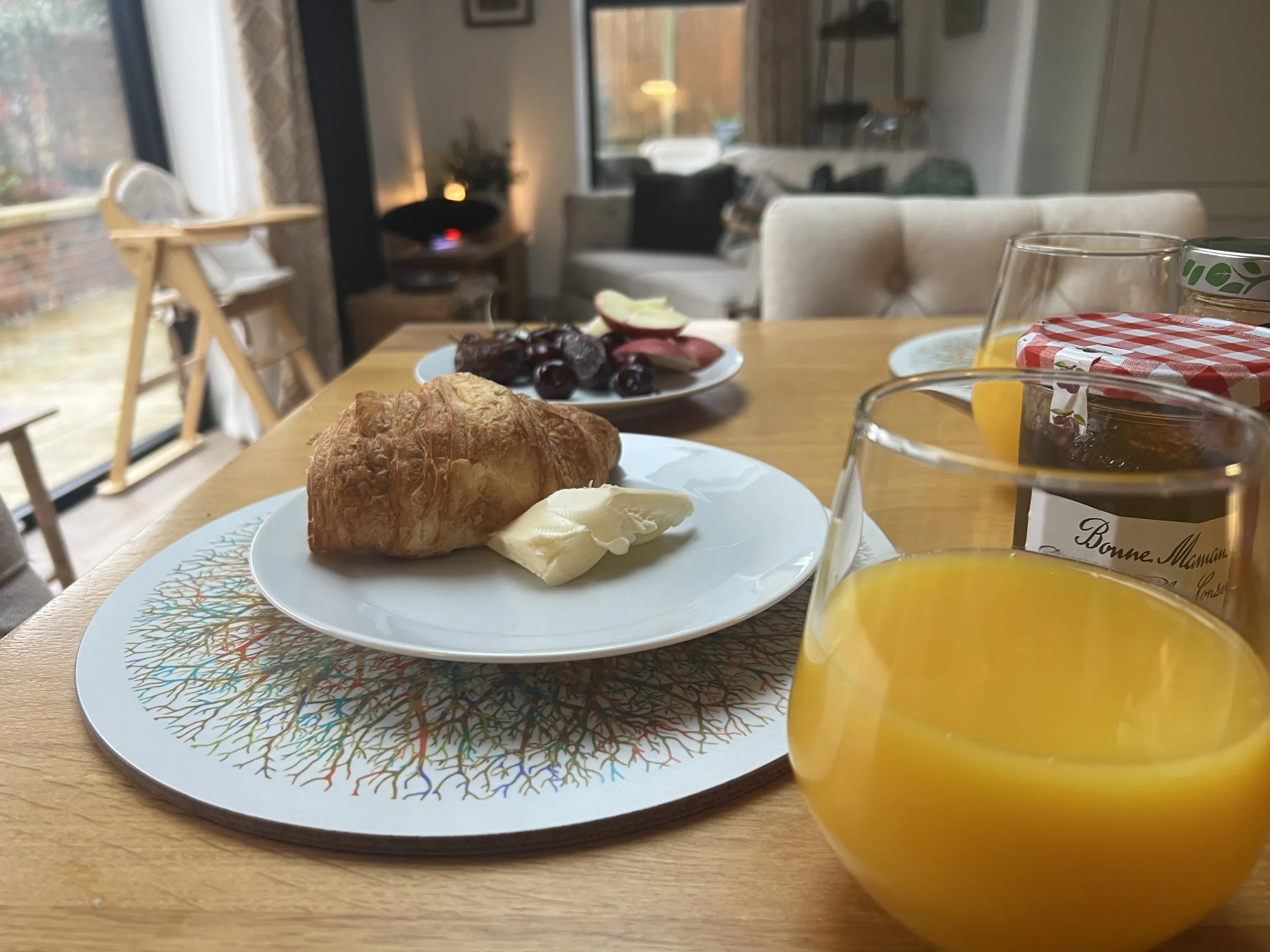 a plate of food and a glass of orange juice at Havendale Accessible Holiday Cottage