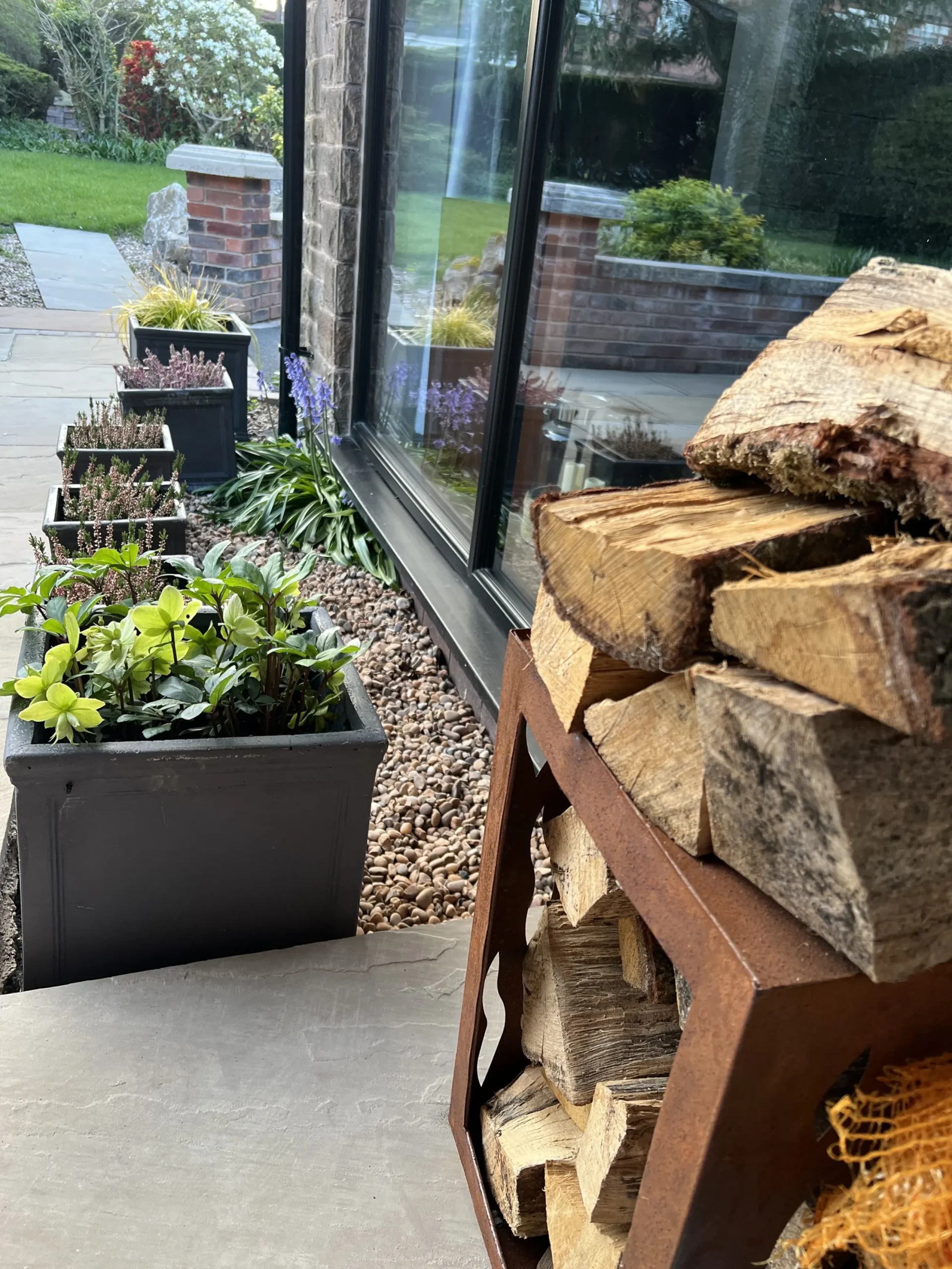 a pile of wood sitting on a patio at Havendale Accessible Holiday Cottage