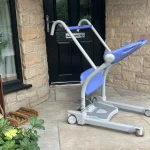 a blue and white mobility aid sitting on a patio at Havendale Accessible Holiday Cottage