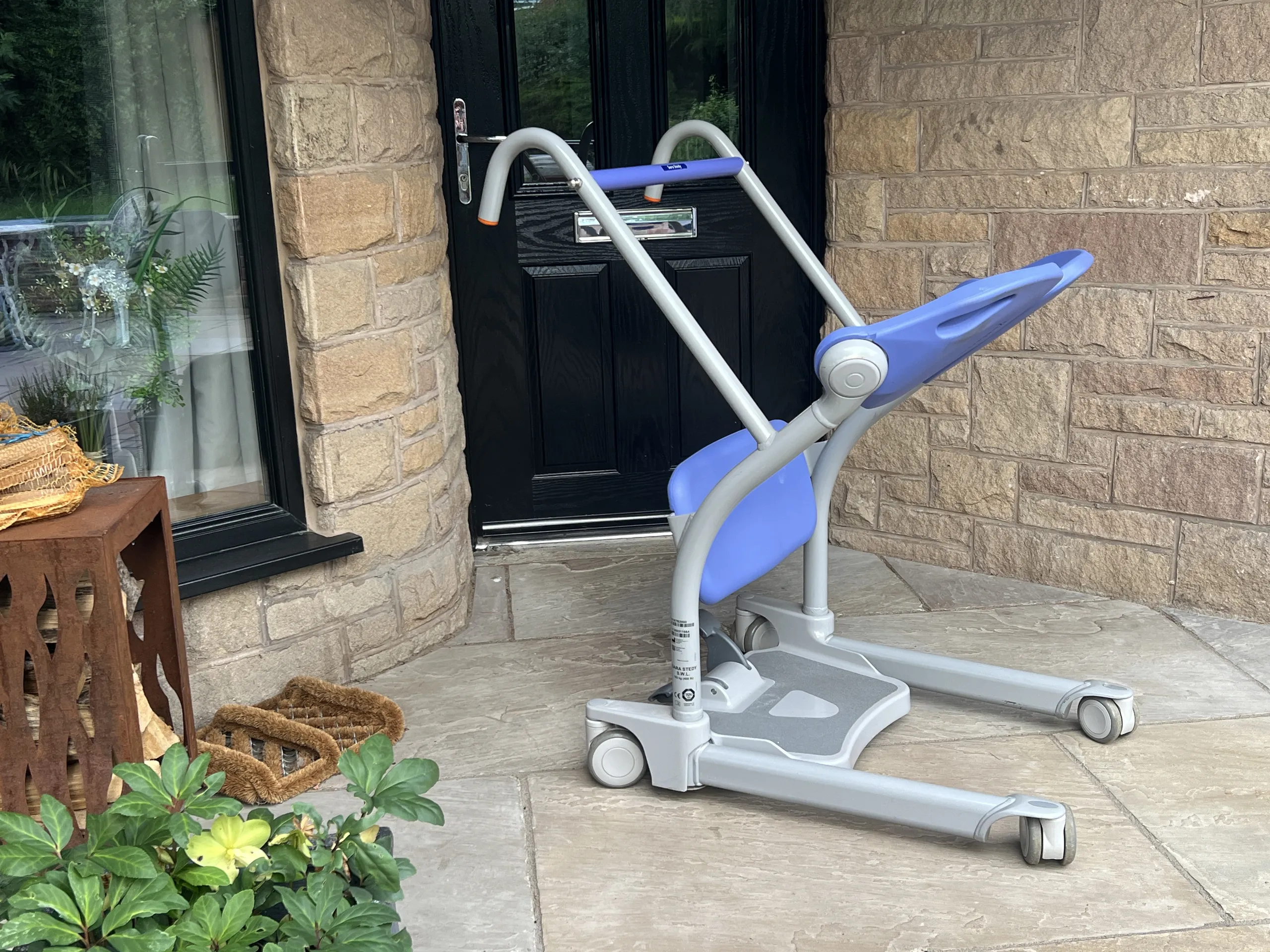 a blue and white mobility aid sitting on a patio at Havendale Accessible Holiday Cottage