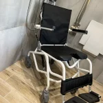 a wheelchair in a shower at Havendale Accessible Holiday Cottage