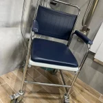 a blue and white shower seat with chrome legs at Havendale Accessible Holiday Cottage